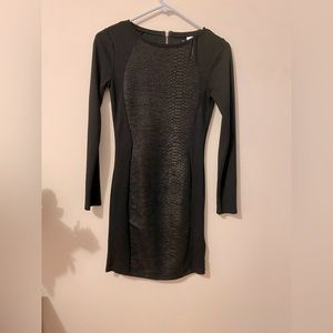 It's the dress that looks like a combination of snake print and stretch fabric.